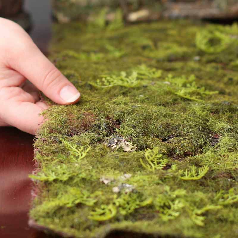 The Spotted Donkey artificial green grass and moss mat for crafts, showing realistic texture and flexible base.